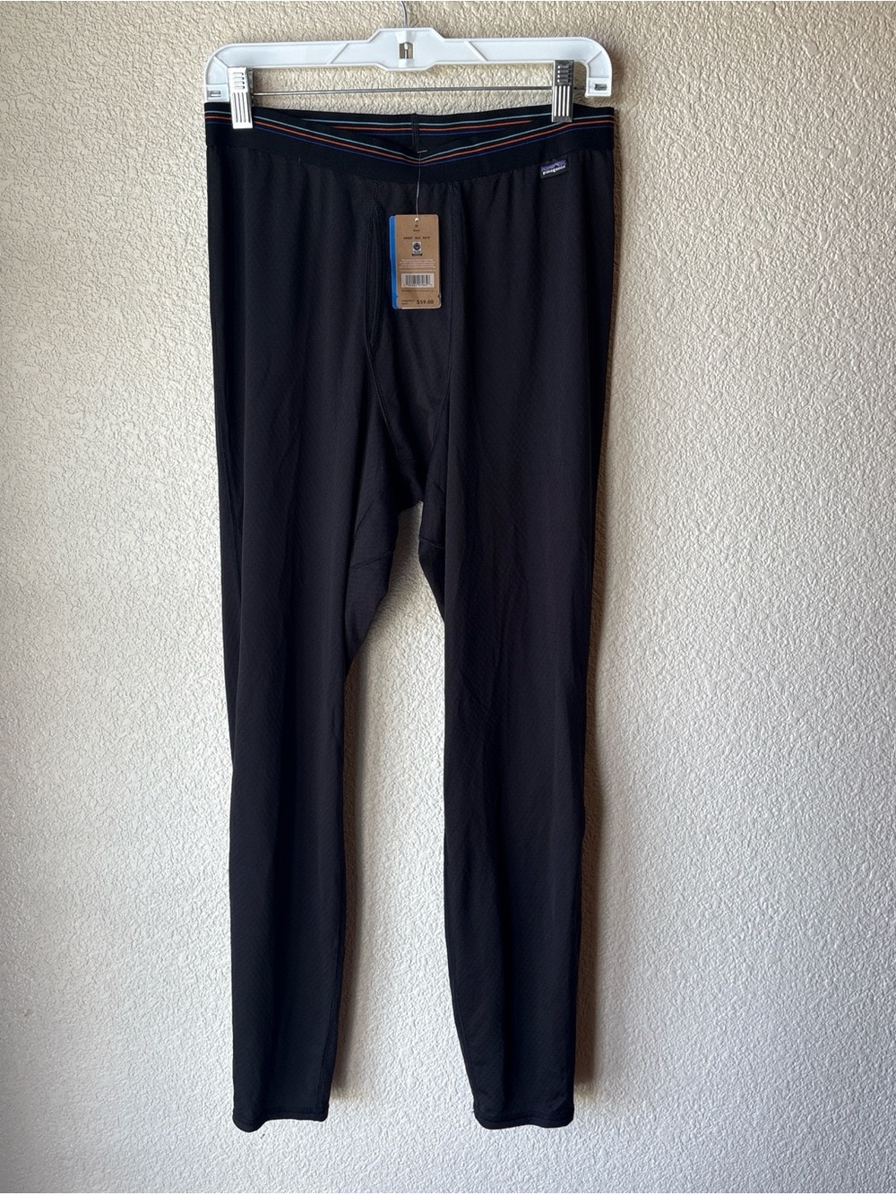 Patagonia Black pants with Blue, Teal and Orange Stripe Waistband